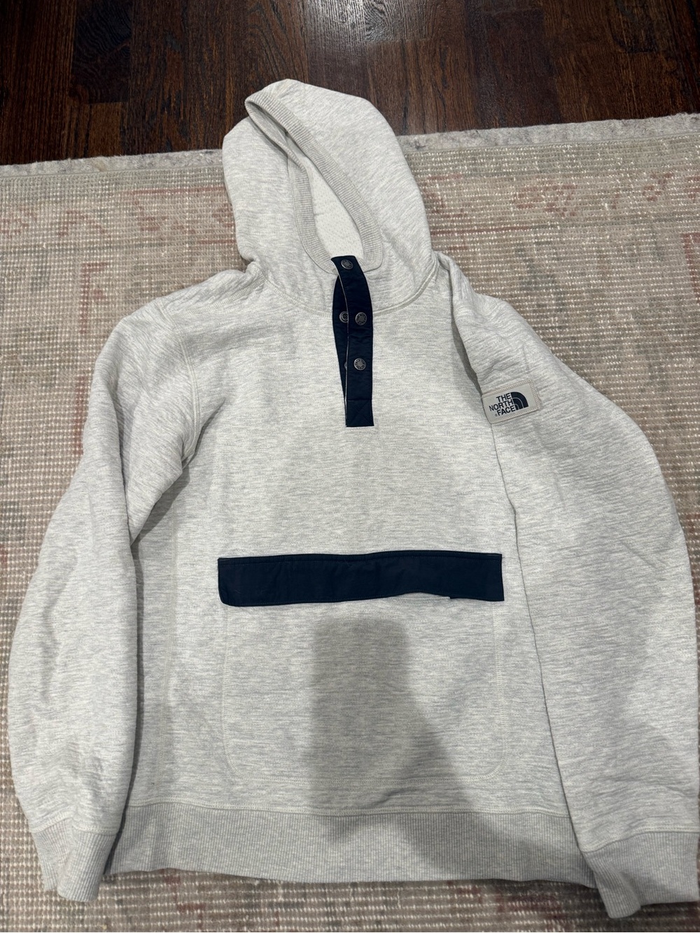 The North Face Men’s cream Hooded Pullover with navy Accents